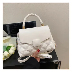 White quilted flap handbag with stylish braided top handle and crossbody strap for women.
