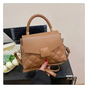 Stylish brown quilted PU leather flap crossbody bag for women with braided top handle and strap.