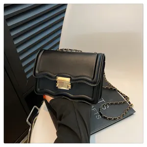 Black wave chain crossbody bag, stylish women shoulder bag, trendy minimalist design detail.