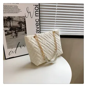 Chic quilted chain tote bag with vintage design, spacious shoulder bag for women daily use.