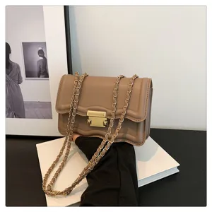 Stylish wave pattern chain shoulder bag for women, elegant small square crossbody bag detail.