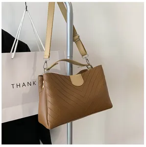 Brown chic crossbody shoulder bag with chevron stitching and stylish contrast strap.