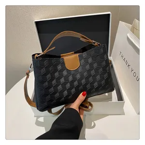 Stylish women's PU leather top handle shoulder bag detail view with geometric pattern.