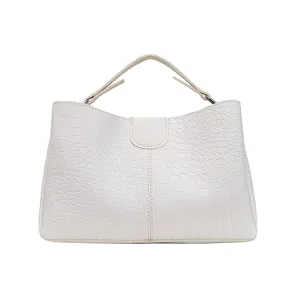 White crocodile pattern handbag detail, PU leather top handle purse for women chic design.