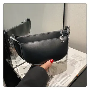Black PU leather crescent saddle bag, chic shoulder handbag with metallic chain and dual zipper.