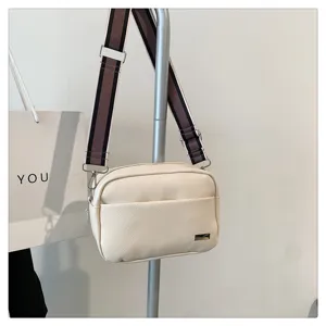 Stylish women crossbody bag with wide strap, minimalist PU leather daily shoulder bag.