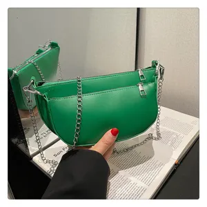 Green crescent shoulder bag detail, stylish PU leather hobo handbag with silver chain.
