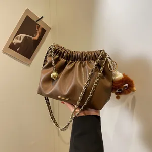 Trendy brown PU leather shoulder bucket bag with chain strap and cute plush charm for women