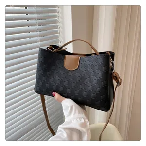 Stylish black PU leather handbag with geometric pattern, top handle and crossbody strap.