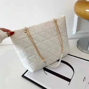 Large capacity white quilted shoulder bag with gold chain straps, stylish women's tote bag.