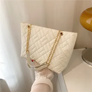 White quilted tote bag with gold chain strap, stylish shoulder handbag for women daily wear.