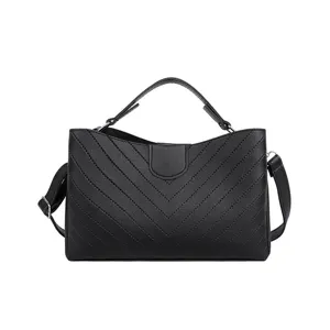 Black chevron quilted shoulder bag detail view showing fine stitching and premium PU leather finish.