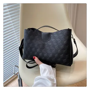 Black PU leather geometric embossed handbag, stylish casual shoulder and crossbody bag for women.