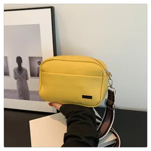 Women PU leather crossbody bag, minimalist small square bag with trendy wide strap for autumn.