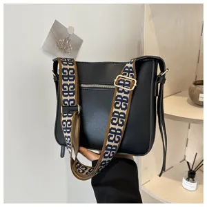 Black shoulder bag with wide monogram strap, stylish commuting large capacity crossbody handbag.