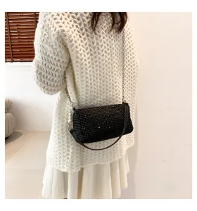 Stunning black rhinestone shoulder bag with chic chain strap, sparkling crystal underarm handbag.