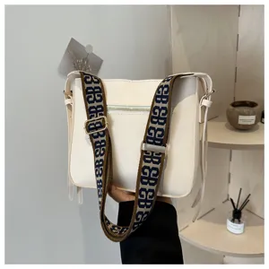 Stylish white crossbody shoulder bag for women with wide patterned jacquard strap commute use.