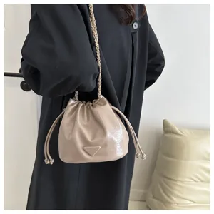 Stylish women's bucket bag with chain strap and drawstring closure for daily fashion wear.