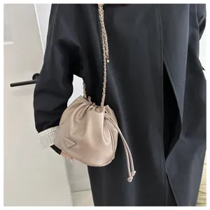 Stylish women shoulder bucket bag with chain strap and chic drawstring closure design.