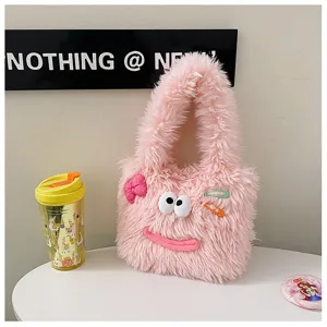 Cute pink fuzzy plush handbag detail, fluffy texture with funny eyes and hair clips.