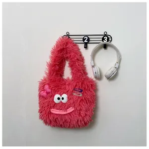 Cute fuzzy plush tote bag for women, fluffy winter shoulder handbag with funny eyes and bow.