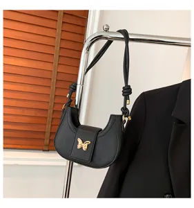 Chic black underarm shoulder bag for women featuring a stylish gold butterfly accent and knots.