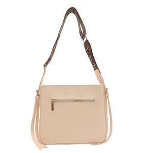Beige women crossbody shoulder bag with wide monogram strap and tassels, PU leather handbag.