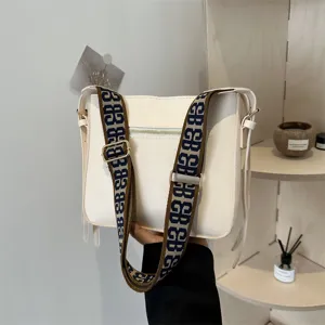 Women white shoulder bag casual crossbody bag with wide jacquard strap for daily commute.