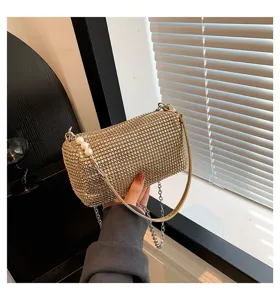 Chic gold rhinestone shoulder bag for women, sparkling crystal design with elegant pearl accent.