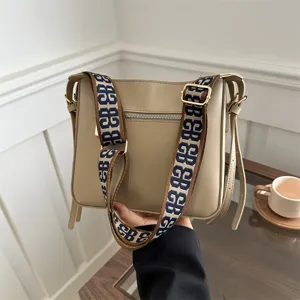 Casual commute shoulder bag with wide strap, trendy large capacity bucket bag for women.