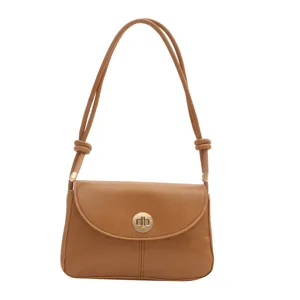 Close up view of brown PU leather shoulder bag strap and metal turn lock detail.