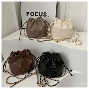 Stylish women bucket bag PU leather shoulder crossbody bag with chain strap and chic design.
