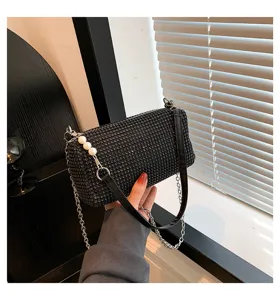 Black rhinestone shoulder bag for women, sparkling crystal underarm bag with chain strap.