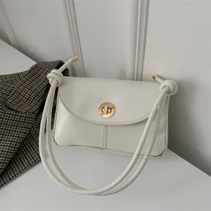 Minimalist white leather shoulder bag for women, chic retro design with gold turn-lock and knots.