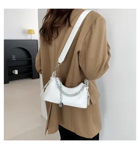 Stylish white underarm shoulder bag with silver chain and wide strap detail, detail view.