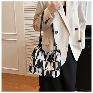 Black and white knitted tote bag with cute bunny pattern, casual shoulder bag for women.