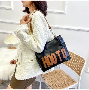 Fashionable large capacity PU leather shoulder tote bag for women, versatile student class bag.
