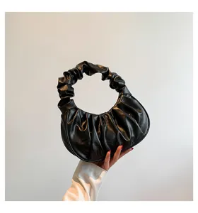 Detailed view of the black ruched cloud bag, showing soft PU leather texture and stylish pleated design.
