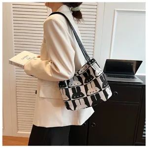 Fashionable black and white rabbit pattern knit shoulder tote bag for women daily casual use.