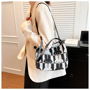 Black and white knitted shoulder bag featuring cute rabbit pattern for daily fashion wear.