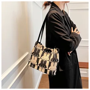 Chic black and white knit shoulder bag, stylish rabbit pattern tote bag for women daily use.