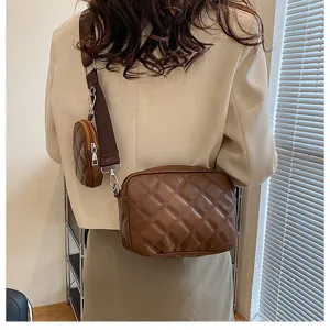 Brown quilted crossbody bag detailed view showing PU leather texture and strap coin pouch design.
