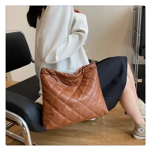 Chic quilted shoulder bag for women featuring a stylish chain strap and spacious interior.