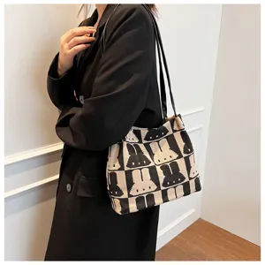 Fashion knitted shoulder bag for women, chic black and white bunny pattern tote bag.