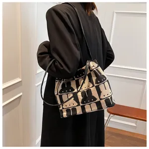Black and white canvas tote bag with cute rabbit pattern, stylish shoulder bag for women.