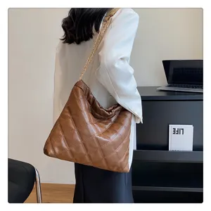 Brown quilted shoulder bag for women with chic chain strap, casual large hobo tote daily use.