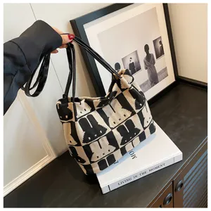 Chic black and beige knit tote bag with cute rabbit pattern, stylish shoulder bag for women.