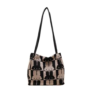 Black and white knit tote bag with cute rabbit pattern, stylish casual single shoulder bag.