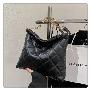 Black quilted chain shoulder bag for women, large capacity stylish casual tote handbag design.