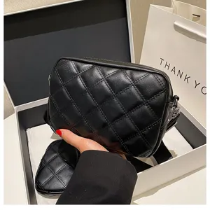 Black quilted crossbody bag with small coin purse, stylish PU leather shoulder bag.